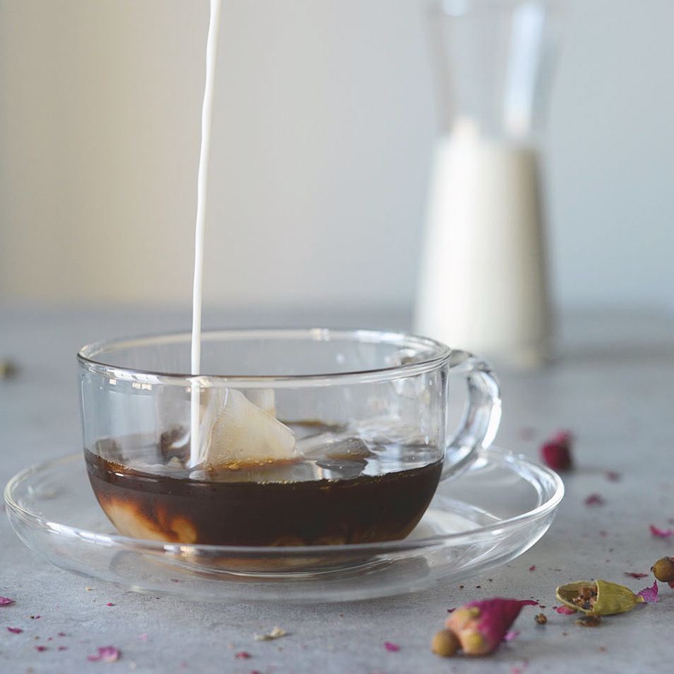 Cardamom rose iced coffee - the warmth of cardamom spice and the floral notes of rose meet in this earthy, delicate Persian-style coffee cocktail. 